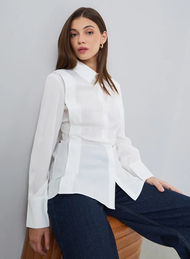 ستايلي بلوزة سادة بأزرار وقصة واسعة